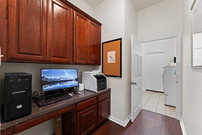 Office space featuring baseboards and dark wood-type flooring | Image 35