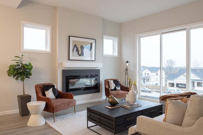 This home features strategically placed windows that maximize natural light, creating a bright and inviting atmosphere throughout. Photos are from previously built home; options and features will vary. | Image 10