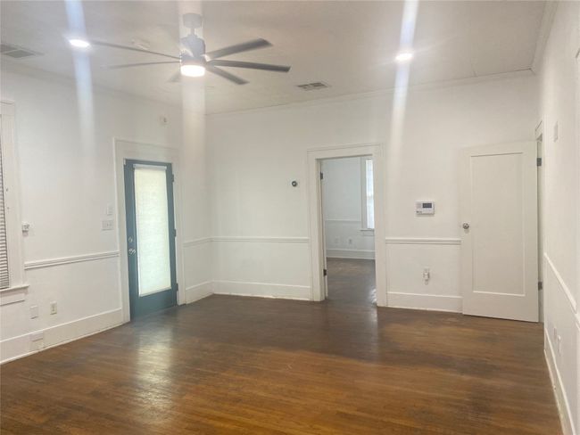 Front room featuring ceiling fan, ornamental molding, and wood finished floors | Image 7