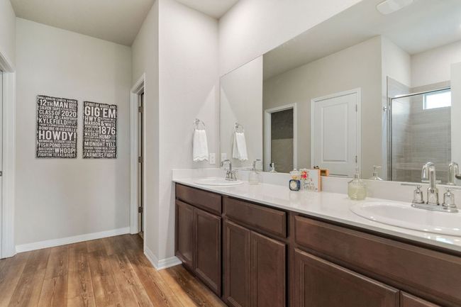 Primary bathroom with double vanity. | Image 12