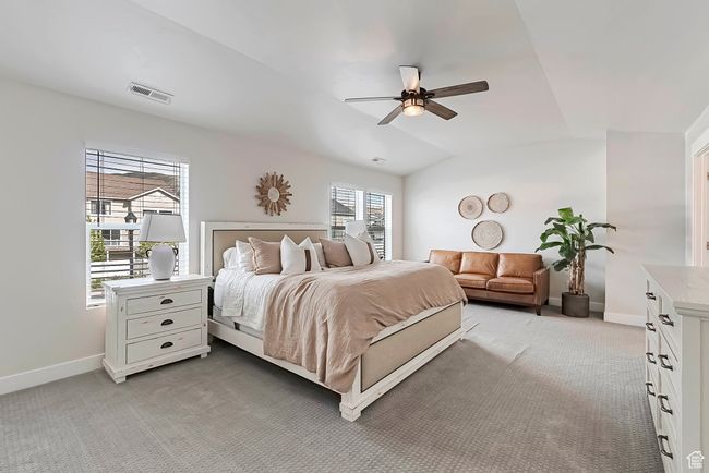 Master Bedroom with light colored carpet, baseboards, and ceiling fan | Image 12
