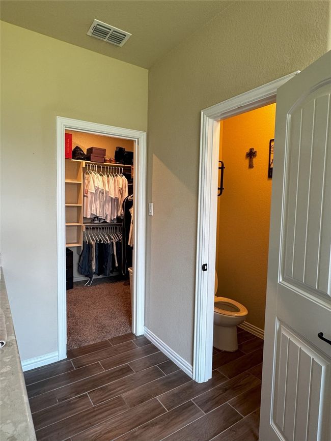 Master Bathroom with wood finish floors and a spacious closet | Image 10