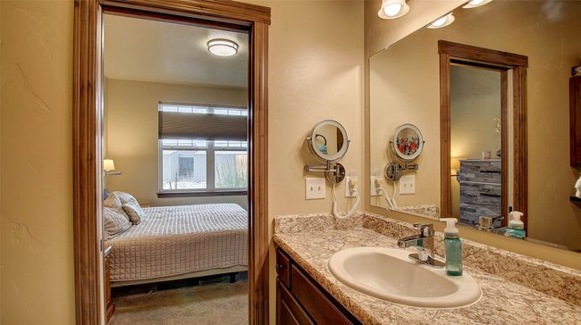 Primary Bathroom offers walk-in shower, extra storage cabinets and electric wall heater | Image 23