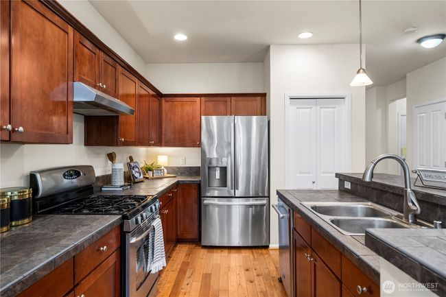 sprawling kitchen/dining area flows seamlessly out to the back patio and into the large living room! | Image 12