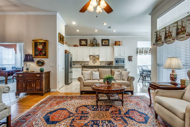 Living room featuring a ceiling fan, recessed lighting, light wood-type flooring, and ornamental molding | Image 8
