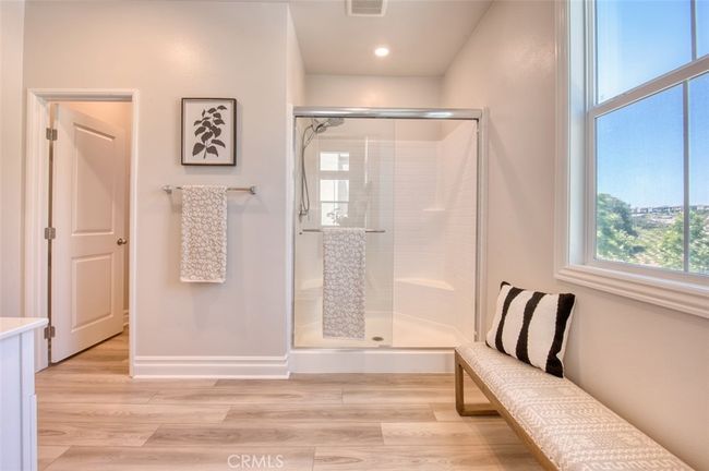 Primary bedroom en-suite bathroom with step-in shower. | Image 17