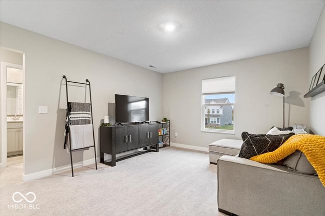 living room with light colored carpet and baseboards | Image 29