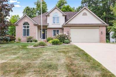 View of front property featuring a garage and a front lawn | Image 1