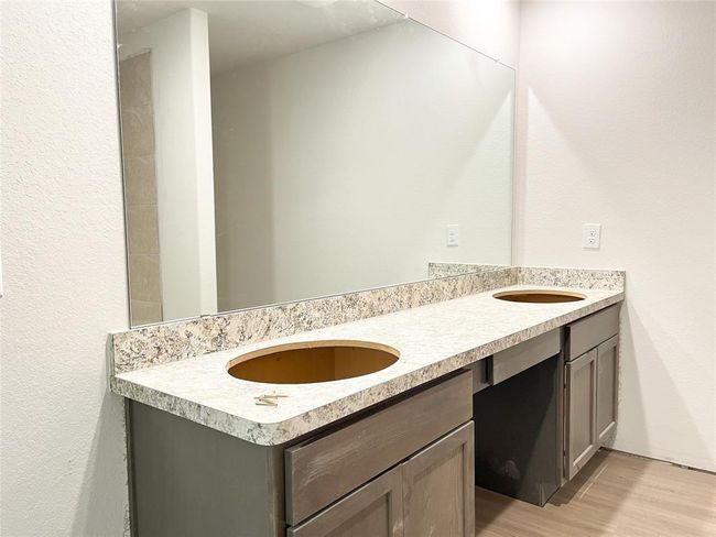 Upstairs master bathroom features an almost complete double sink vanity, ready for your personal touch. | Image 16