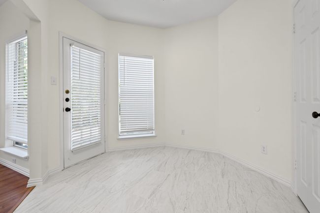 Breakfast area in kitchen is adjacent to dining area | Image 11