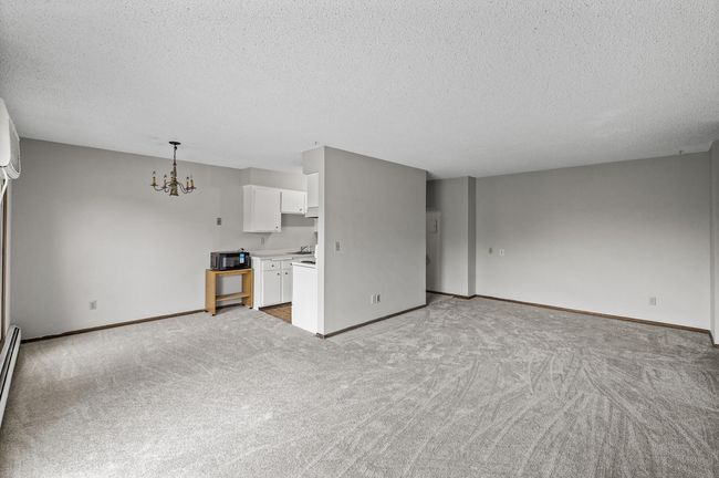 Open layout with the large living room, dining & kitchen. | Image 5
