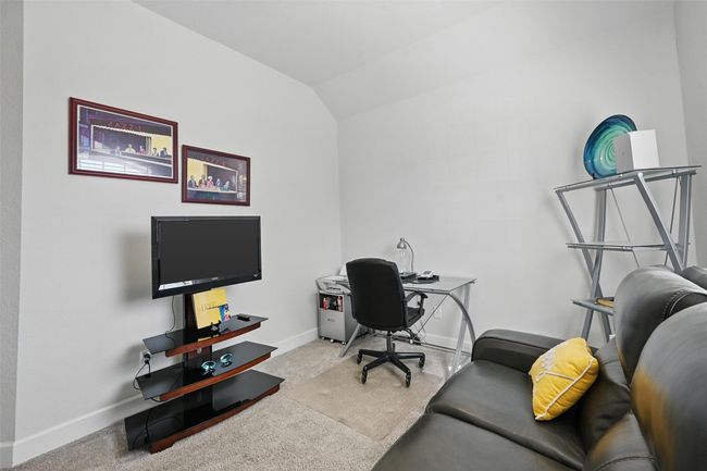 Carpeted office featuring baseboards and vaulted ceiling | Image 18