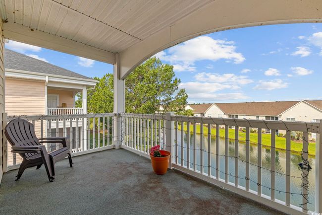 Balcony featuring a water view and a residential view | Image 21