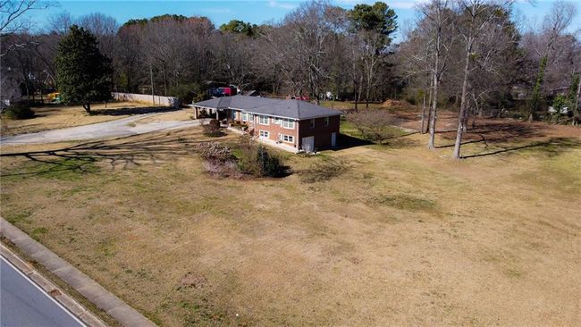4983 Arcado Rd Sw, House other with 5 bedrooms, 2 bathrooms and 6 parking in Lilburn GA | Image 5