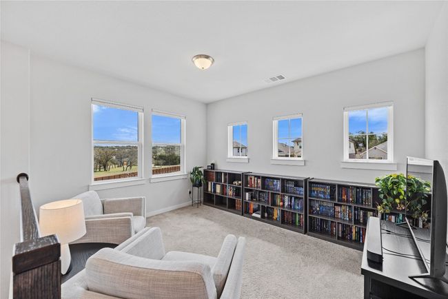 Sitting room with baseboards, visible vents, and carpet flooring | Image 13