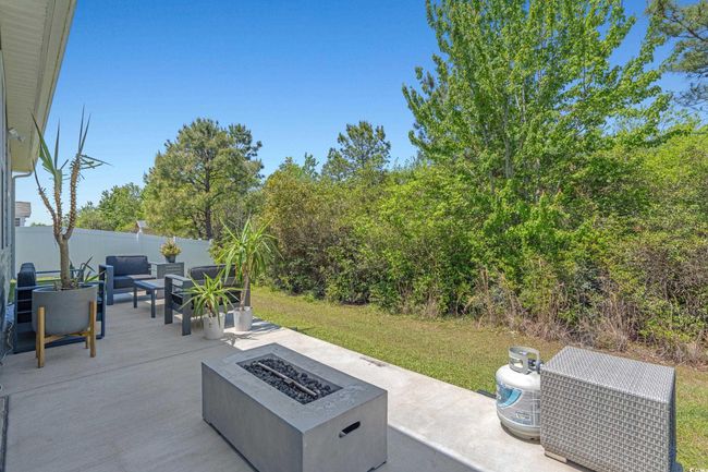 View of patio with a fire pit | Image 38