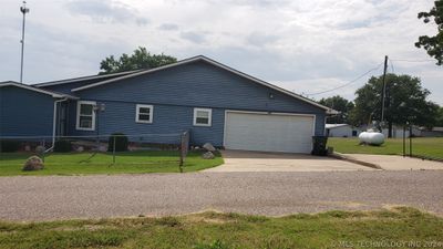 Side view of house and garage area. | Image 3