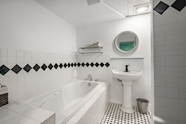 Full bathroom featuring a bath and tile patterned floors | Image 26