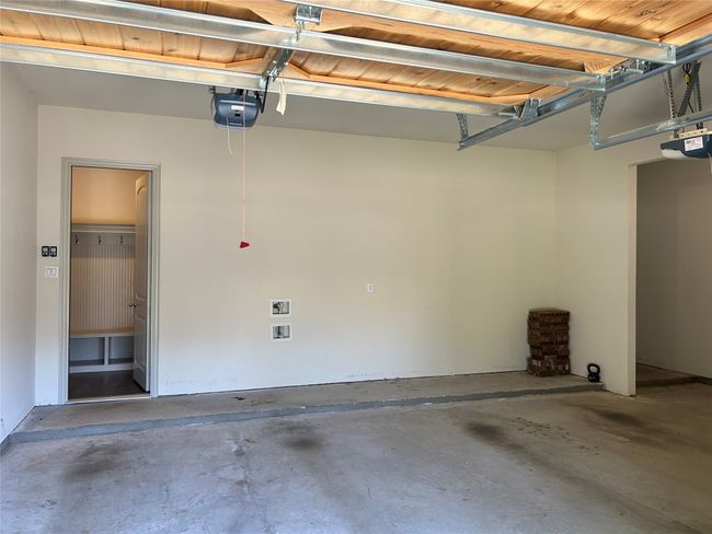 Garage featuring a garage door opener | Image 24