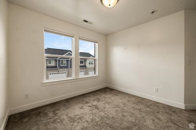 Carpeted empty room with baseboards and visible vents | Image 19