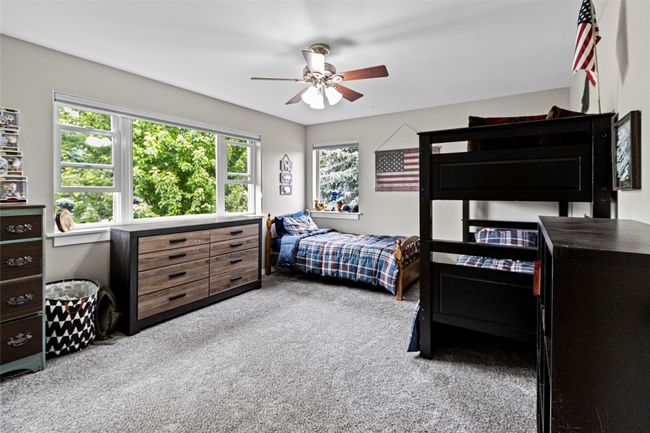 Bedroom with carpet floors and ceiling fan | Image 53