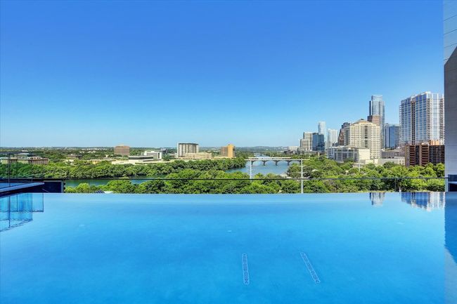 View of pool with a city view and a water view | Image 9
