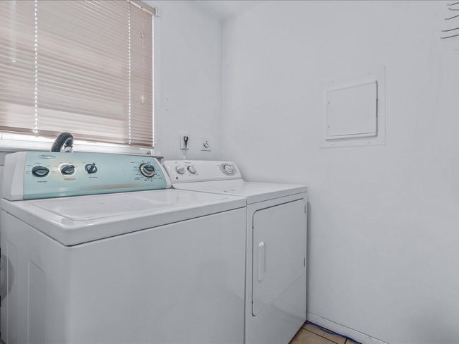 Laundry area with independent washer and dryer | Image 26