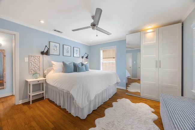 Bedroom # 1 is spacious and offers a a built-in wardrobe that stays with the home for added closet space. | Image 16