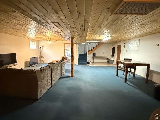 Below grade area featuring stairway and wood ceiling | Image 15