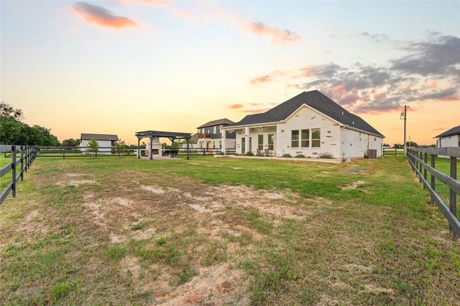 Back of house at dusk featuring a gazebo | Image 30