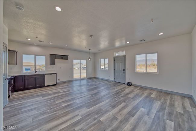 Another view of the Laila Floor Plan living room, showcasing its spacious open-concept design perfect for modern living. **These are model photos, light fixtures subject to change.** | Image 5