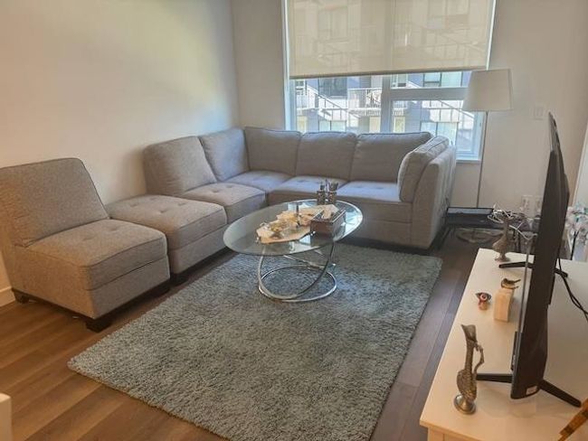 Living room featuring wood finished floors | Image 10