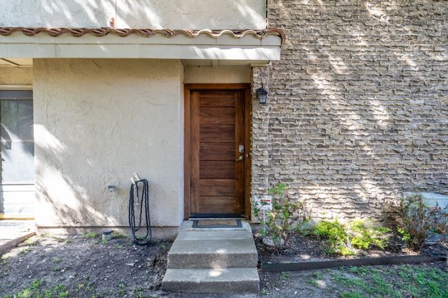 Main entry with stucco siding | Image 5