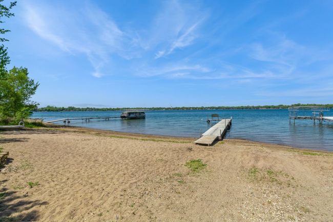 This home has an association maintained beach area that comes with use of the dock and picnic areas. It is located about a half block from this home. The association dues are currently $70 a year. | Image 57
