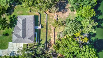 Beautiful location on large corner lot. Four breathtaking tiers of trees and grass culminating to adjacent Hulen Parks creek with Cleburne's famous ducks and geese! | Image 3