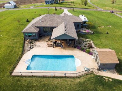 View of swimming pool featuring a patio and a yard | Image 2