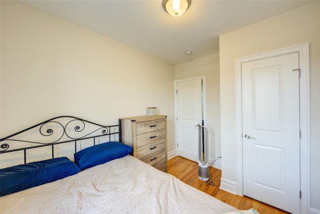 Bedroom featuring baseboards and light wood-style floors | Image 8