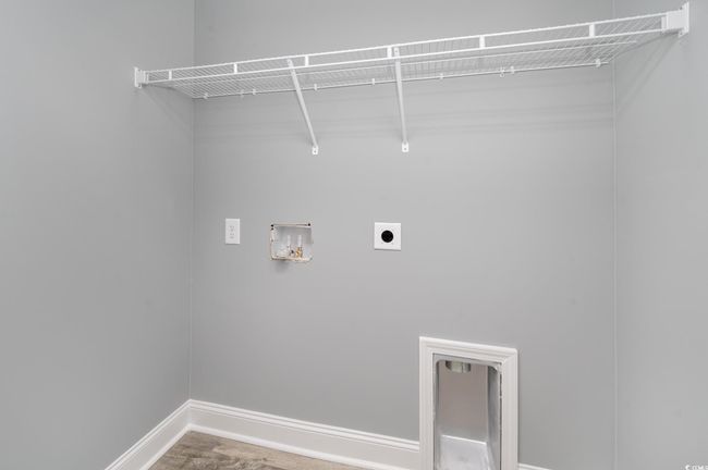 Laundry area featuring hookup for an electric dryer and washer hookup | Image 21