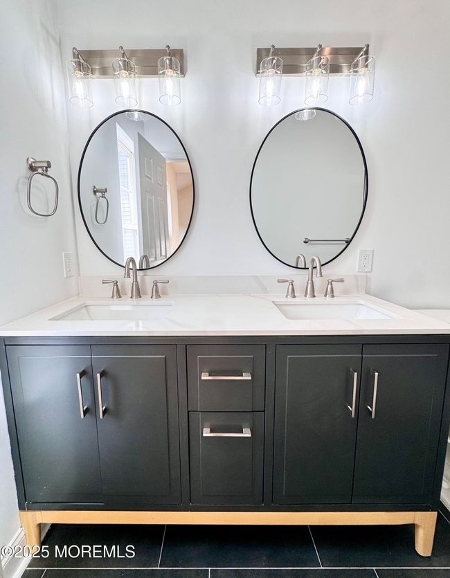 Vanity with double sinks and mirrors in the primary bath | Image 20