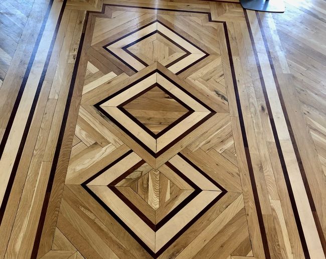 The beautiful hardwood floor inlay greets guests a | Image 9