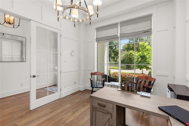 Glass french doors, 6-light chandelier, pull down shades. | Image 10