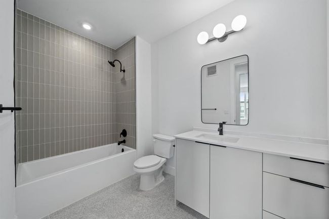 Second bathroom featuring a tub | Image 19