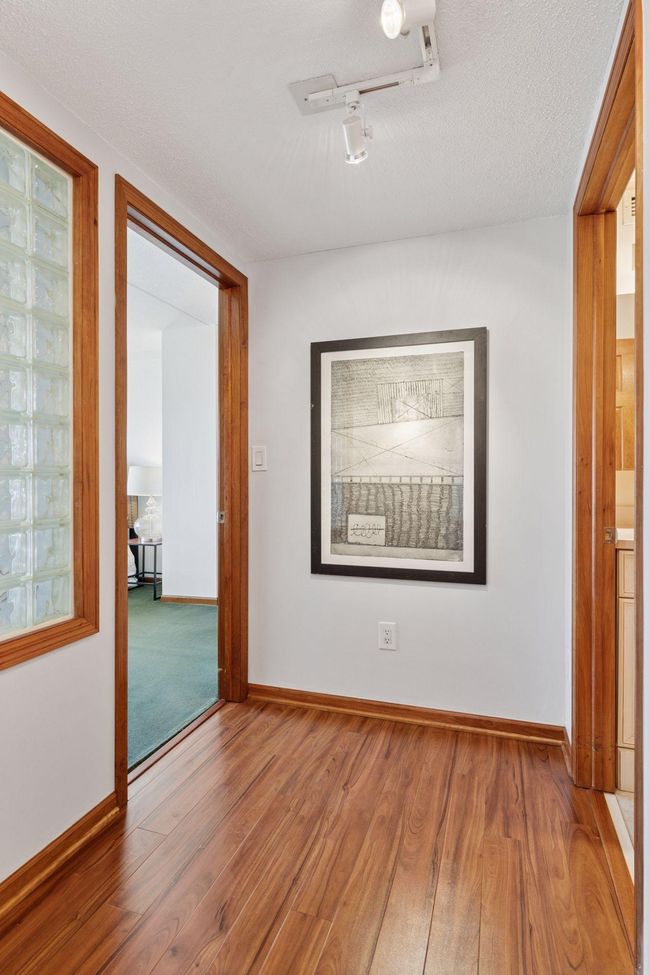 Glass block lets light through to the entry hall | Image 20