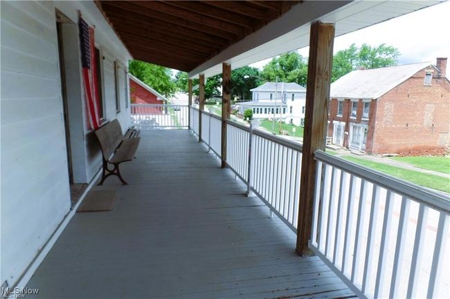 Wooden deck featuring a residential view | Image 10