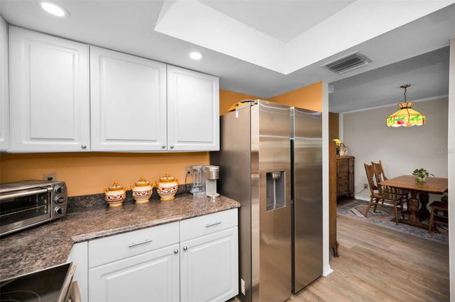Newer can lighting in Kitchen | Image 35