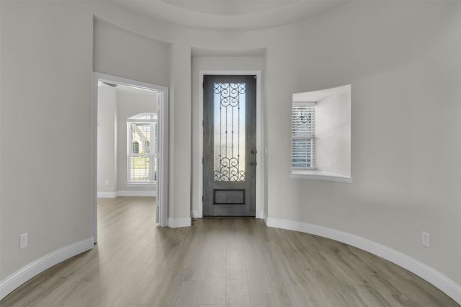 Foyer featuring light wood-type flooring and a wealth of natural light | Image 10