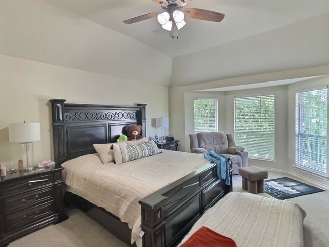 Bedroom featuring carpet flooring and a ceiling fan | Image 9