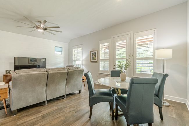 Dining space featuring ceiling fan, baseboards, and wood finished floors | Image 26