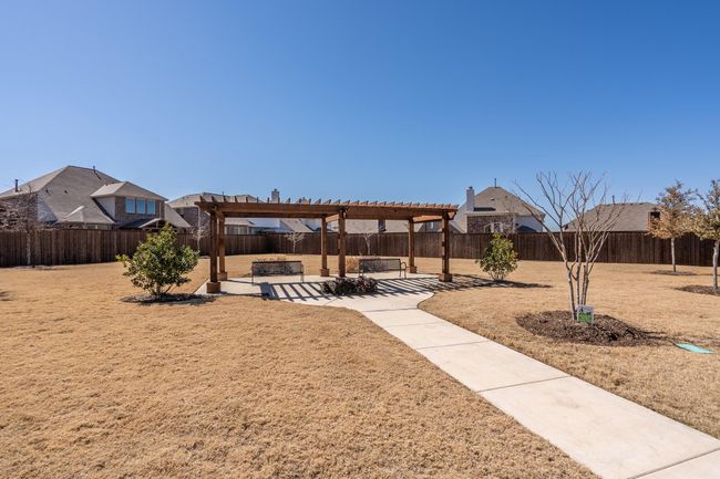 View of yard with a pergola, a patio, and a fenced backyard | Image 25