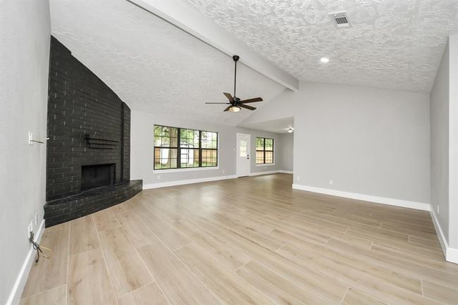 Living room with fireplace | Image 5